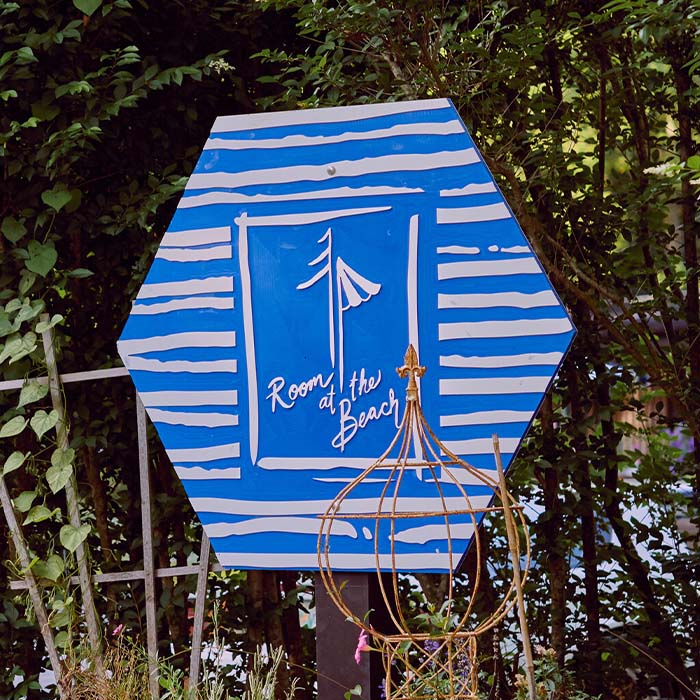Room At The Beach sign